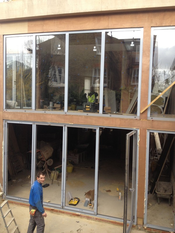 Aluminium bi-fold doors with two-storey glazing in Wandsworth