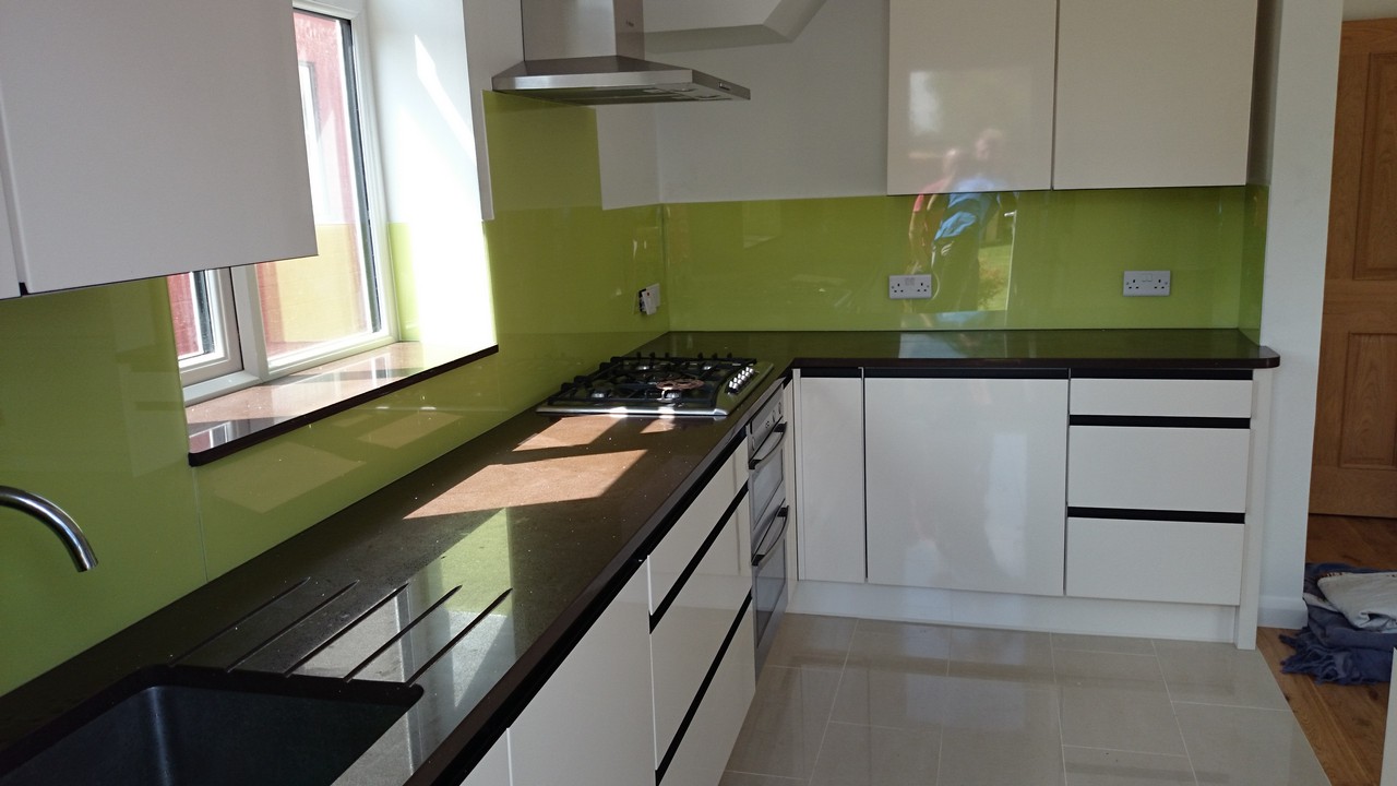 Lime green glass kitchen splashback installed by Wandsworth glaziers