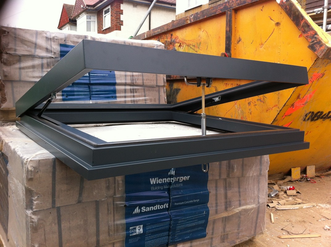 Opening flat roof skylight in anthracite grey installed in Wandsworth